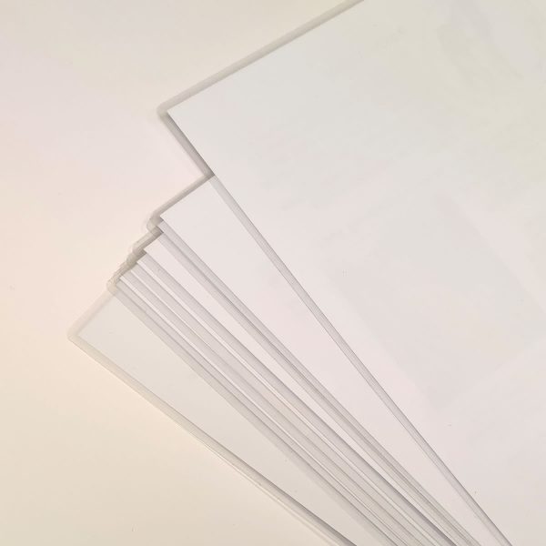 A stack of laminated or encapsulated printed sheets