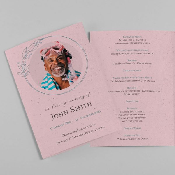 A funeral order of service. The card is pink and has a photo of a smiling man on the front. The inside has details of the funeral service written in a cursive font.