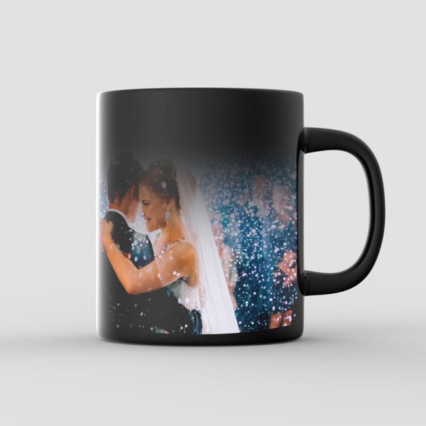 Example of a Heat Activated, Colour Changing Mug. The mug is black and is revealing a photo as the heat in the cup rises.