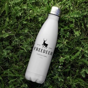 An image showing a custom white metal water bottle with a bold logo on the front of it. The bottle is laying on grass.