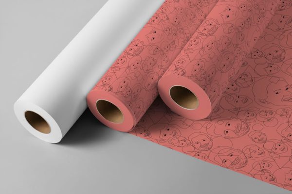 An image showing 3 rolls of wrapping paper. One roll is blank and the other two use a brightly coloured custom design.